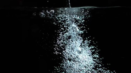 bubbles rising in water shooting with high speed camera slow motion