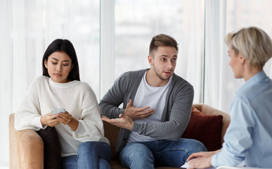 Husband Complaining Marital Therapist About Wife's Indifference Sitting In Office