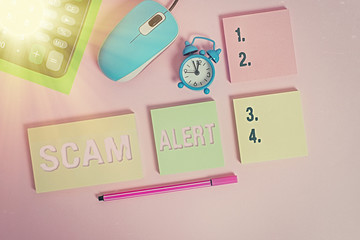 Handwriting text Scam Alert. Conceptual photo unsolicited email that claims the prospect of a...