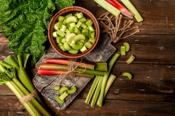 fresh organic rhubarb on cutting board, Cooking rhubarb. Food recipe background. Close up