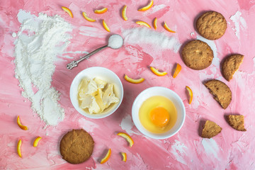 Baking tasty cookies on a pink background