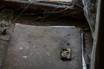 Old document folder in a room with cobwebs