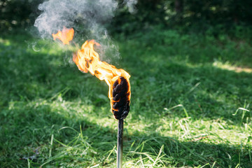the torch burns with a yellow flame