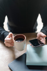 Man's hands with a cup of coffee