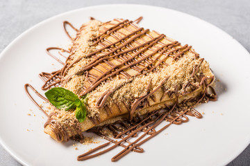 tasty chocolate pancake on plate