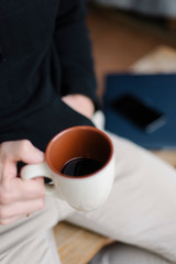 Man's hands with a cup of coffee