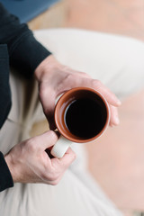 Man's hands with a cup of coffee