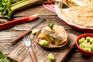 Summer rhubarb cake on vintage scale. Piece of cake on old-fashioned plate. Cooking rhubarb. Food recipe background. Close up
