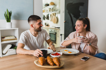 Fototapeta na wymiar romantic man and woman couple having breakfast at home