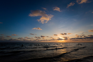 Fototapeta na wymiar People taking sunset bath Phu Quoc