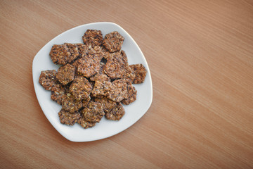 A lot of crunchy crackers on a plate.