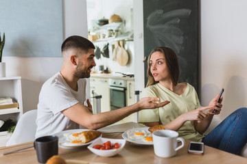 romantic man and woman couple having breakfast at home