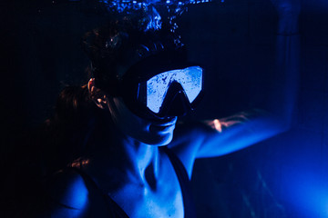 closeup view of beautiful woman in pool water wearing swimming mask