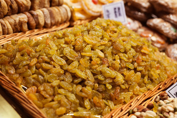 sweet dried raisins on the counter in market