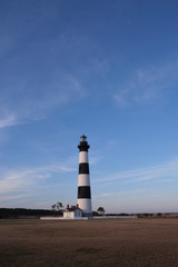 Bodie Island historic Lighthouse in the Cape Hatteras National Seashore at sunset, Outer Banks, North Carolina, USA