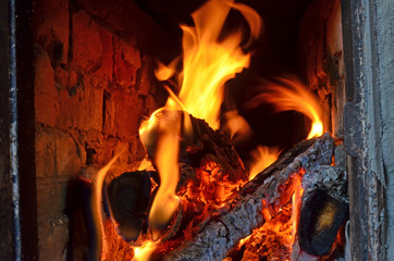 Sparks from fire in fireplace with bokeh balls.
