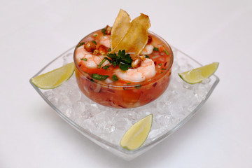 Seviche in a glass plate on a white background
