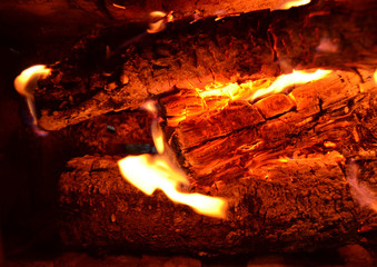 Sparks from fire in fireplace with bokeh balls.