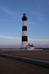 Bodie Island historic Lighthouse in the Cape Hatteras National Seashore at sunset, Outer Banks,...