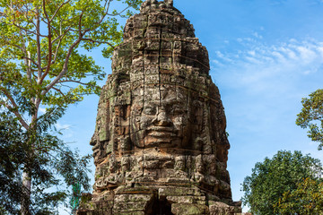 Fototapeta premium Face Stone sculptures of ancient Bayon Temple At Angkor Wat in Siem Reap Cambodia 