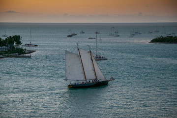sailing boat at sunset aerial view