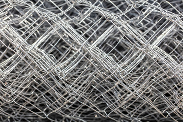 Construction worker metal mesh as background.