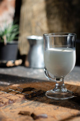 milk on the table in a glass for latte