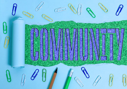 Conceptual hand writing showing Community. Concept meaning specific population with a common characteristics living together