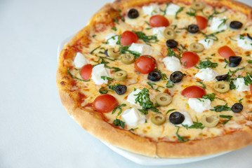 Margherita pizza with Mozarella Cheese, Cherry Tomatoes & Olives,