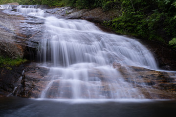 The cascades of the Lower Falls in Graveyard Fields, a very popular waterfall and hiking destination near Asheville, North Carolina in the Blue Ridge Mountains off the Blue Ridge Parkway.