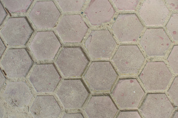 Top view of the hexagonal gray street tile background texture.
