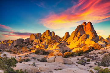 Rocks in Joshua Tree National Park illuminated by sunset, Mojave Desert, California - 353124252