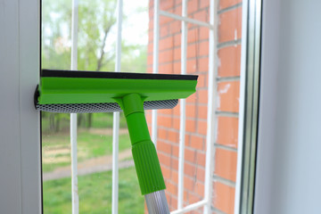 cleaning Windows at home by yourself with rags, sponges and detergents, spring cleaning of house