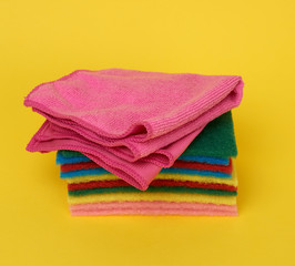 stack of new multi-colored kitchen sponges for washing dishes