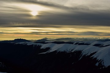 colorfully clouds at sunset in top of the mountain on winter time at high altitudes
