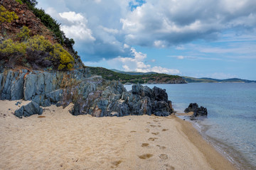 Fototapeta na wymiar Beautiful seascape with beach, rocks and clear transparent water