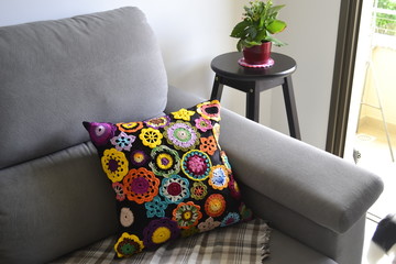 crochet pillow on sofa