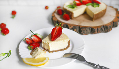 Creamy natural strawberry cheesecake on a white background