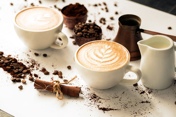 Pour latte art in a coffee cup