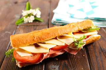 sandwich, baguette with cheese, tomato and prosciutto ham