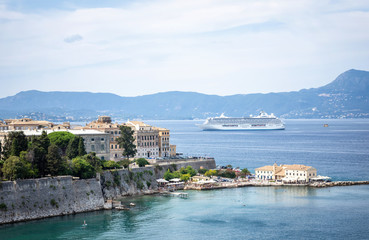 CORFU, GREECE - 10.09.2019 - Faliraki beach Alecos Baths public bathing spot with rock and pier ans...