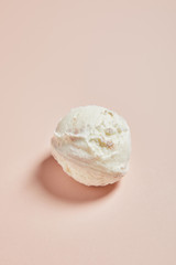 top view of fresh tasty ice cream ball on pink background