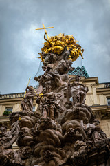Obraz premium Ancient plague pillar. Traditional column in the historic quarter of Vienna, Austria