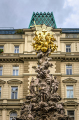 Fototapeta na wymiar Ancient plague pillar. Traditional column in the historic quarter of Vienna, Austria