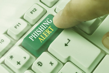 Conceptual hand writing showing Phishing Alert. Concept meaning aware to fraudulent attempt to...