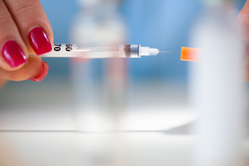 Spitz with insulin in the hands of the patient. Diabetes.