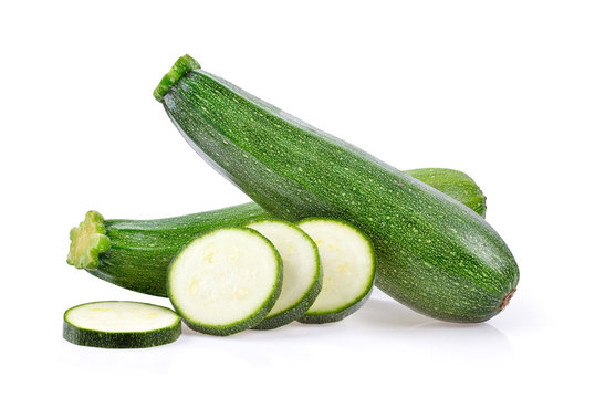 fresh green zucchini with slice on white background