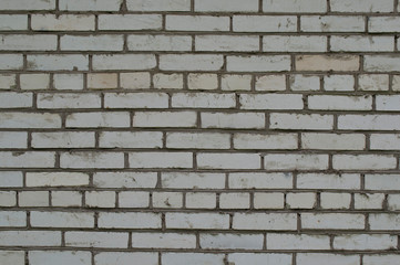 View of the old wall of light brick.