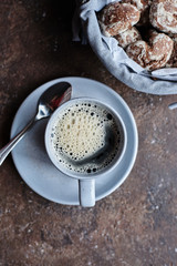 gray mug with coffee and dessert, heart-shaped gingerbread cookies and coffee mug