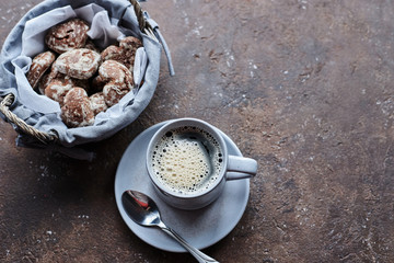 gray mug with coffee and dessert, heart-shaped gingerbread cookies and coffee mug